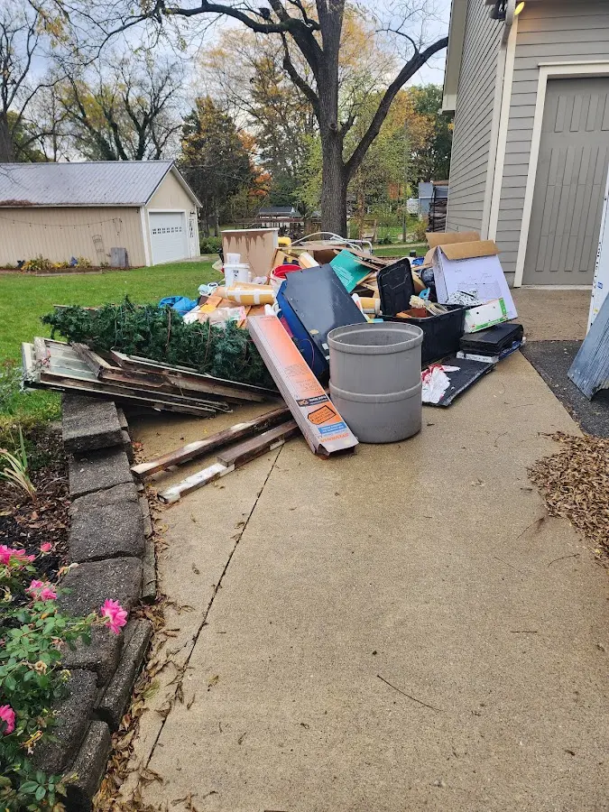 Dumpster being loaded with debris for 30 Yard Dumpster Rental in Niagara